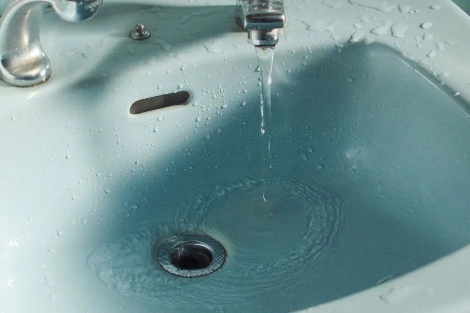 Water flowing from a bathroom faucet